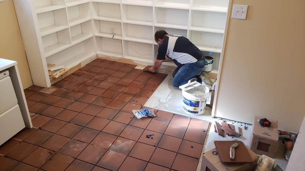 But by late November, walls and bookshelves were repaired and then painted, and water-proof tiles installed in one office.