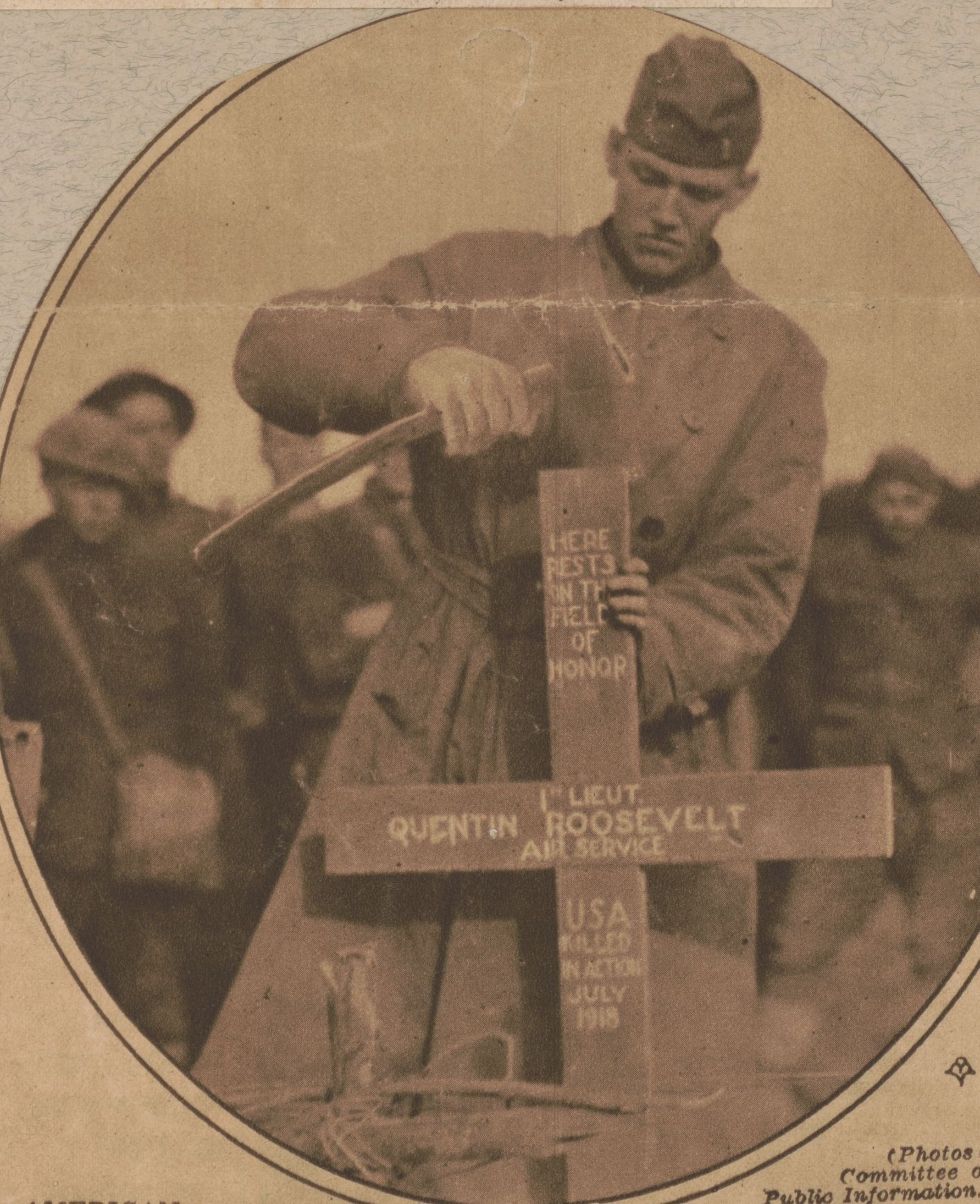 A German soldier hammers on the marker for Lt. Quentin Roosevelt's temporary grave.