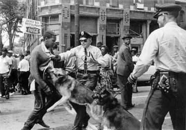 Americans were shocked by images of Birmingham police dogs attacking protesters/