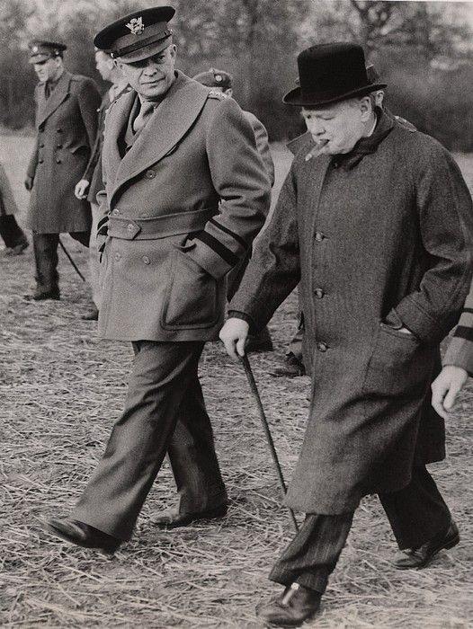 General Dwight Eisenhower, and Prime Minister Winston Churchill inspect preparations for the D-Day invasion.