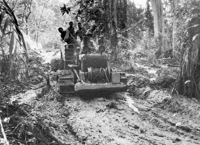 Army engineers in New Guinea struggled to keep roads open through the jungle.
