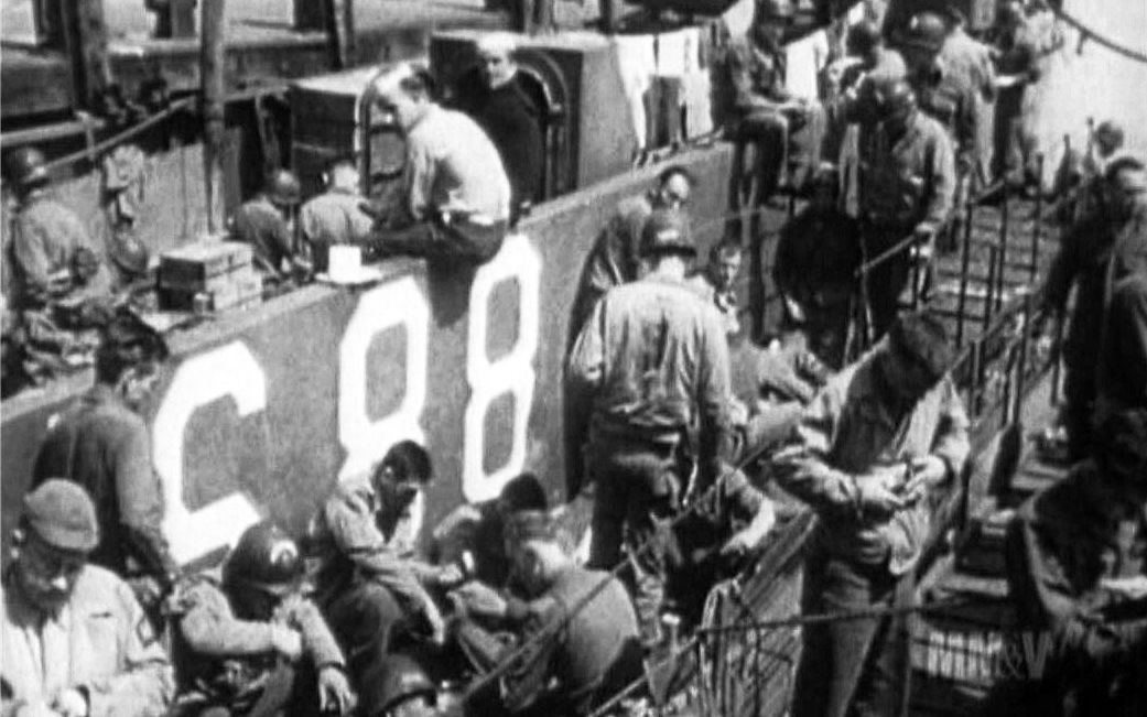 Crew and soldiers aboard LCIL-88 wait before heading to Normandy.