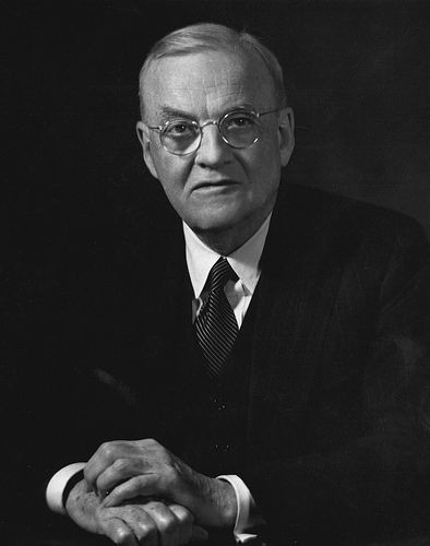 John Foster Dulles, Secretary of State under President Eisenhower, advocated an aggressive stance against communism throughout the world.