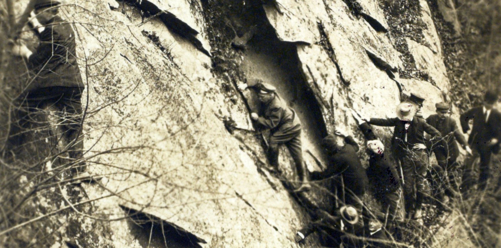 Teddy leads a a group in climbing, probably on Pulpit Rock in Rock Creek Park. Library of Congress.