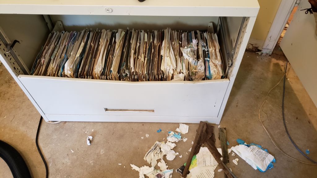 The papers in six file cabinets swelled up so much after being under water that we couldn't open the drawers. We had to destroy the metal cabinets to get to the papers. 