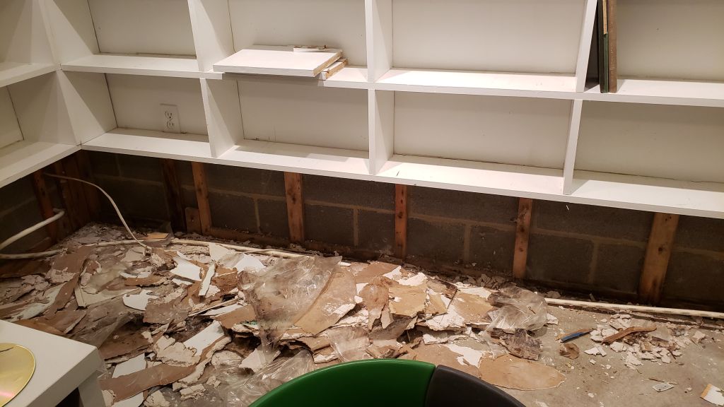 Removing the drywall behind bookshelves caused them to sag and eventually collapse. 