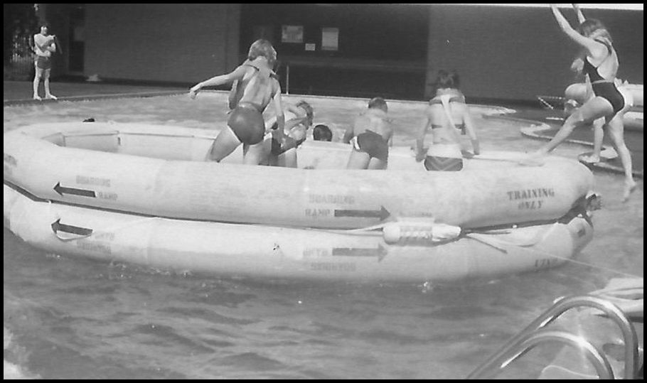 Flight crews practicing with a life raft in the pool of a New Jersey motel show how small was the raft that held TK-number survivors while it was upside-down in the stormy seas.