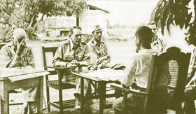 Gen. Edward King discusses terms of surrender with Japanese officers