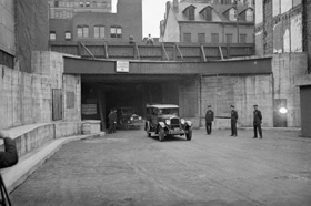 The first car drives through the Holland Tunnel, underneath the Hudson River, on opening day in 1927.