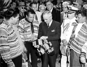 Tribal leaders present President Harry S. Truman with a tribal shirt shortly after the dedication of Everglades National Park.