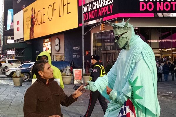 The likeness of Lady Liberty can been seen everywhere in New York, and costumed characters in Times Square offer to pose with tourists. The out-of-towners don't always realize they're supposed to tip the character, leading to headed discussions.  Photo by Edwin Grosvenor.