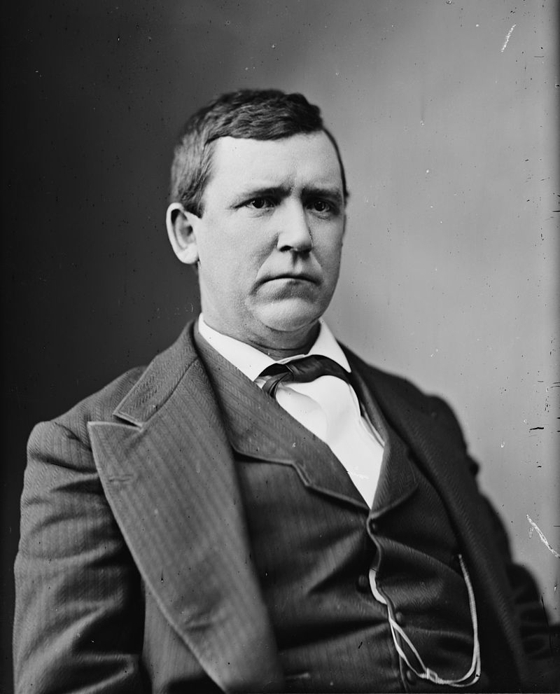 After the U.S. government alleged in a suit that Bell obtained his telephone patent by fraud, it was discovered that the U.S. Attorney General Augustus Garland (anove) owned 500,000 shares of a competing telephone company and would have become rich is the Bell patent was annulled. The "Government suit" against Bell was dropped.