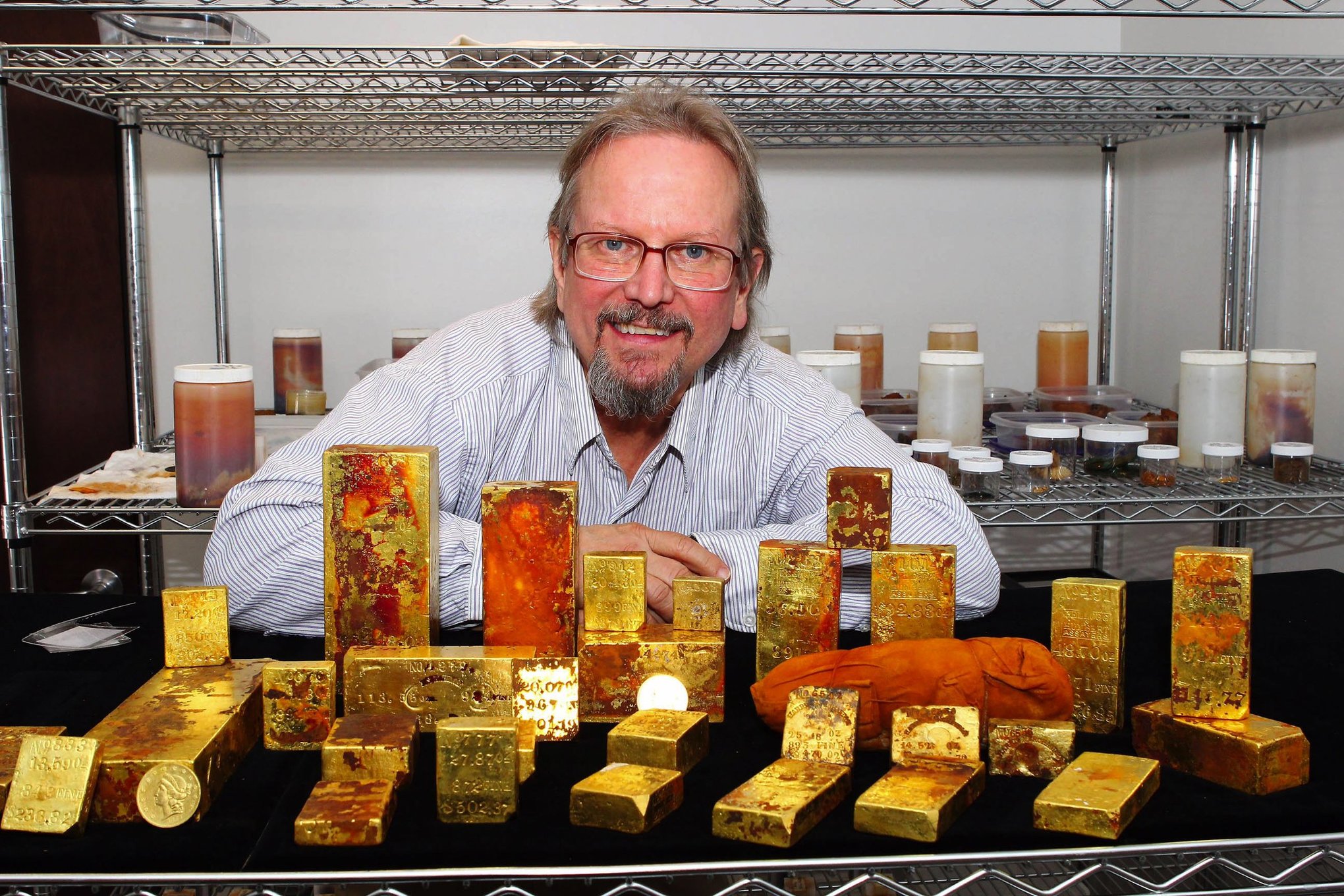 Showing off some of his loot, Bob Evans was chief scientist of the effort to recover tons of gold from the wreck of the Central America, told dramatically in Gary Kinder's book, Ship of Gold.