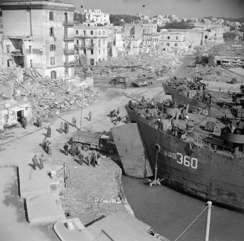 British landing ships unloading supplies in Anzio harbour, 19–24 February 1944. Imperial War Museum.