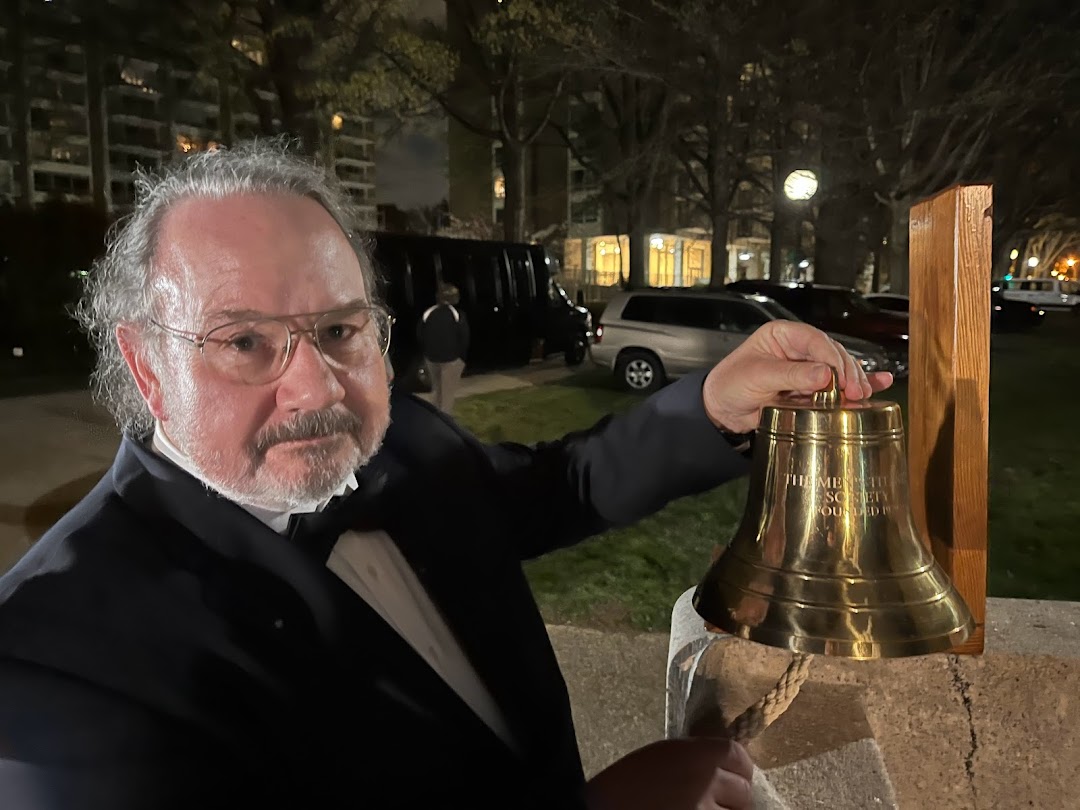 Chris Cavas opened the ceremony by ringing a brass ship's bell.