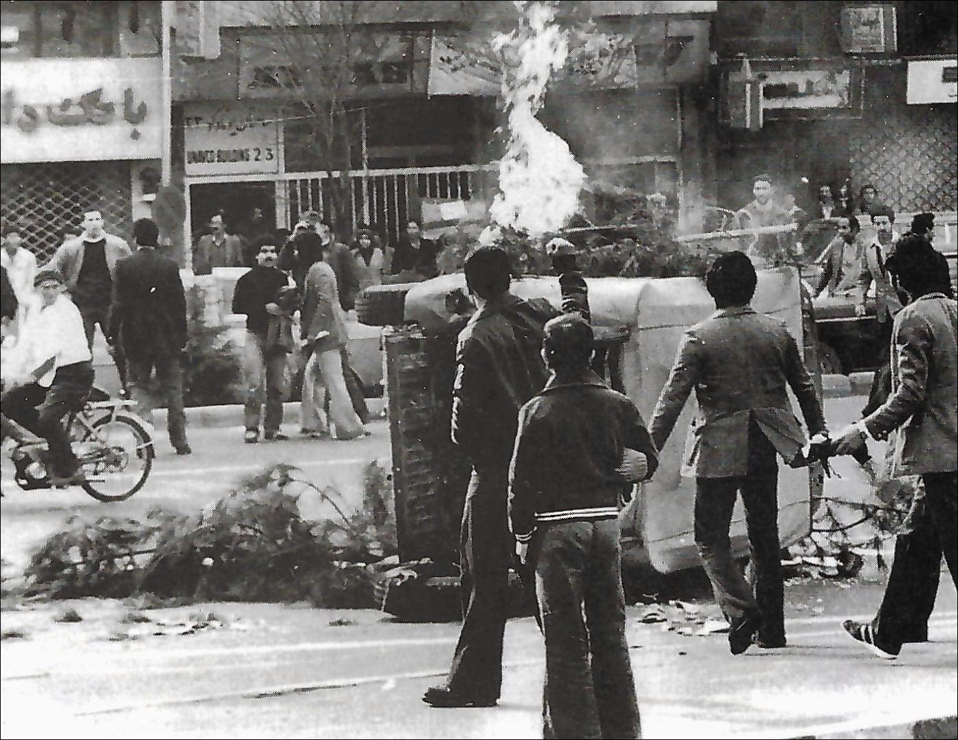 Demonstrators set fire to an Army jeep in Tehran during the rioting in December 1978.