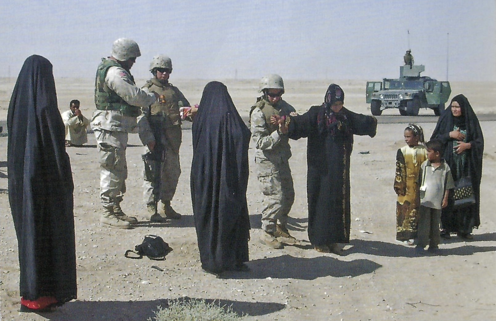 In addition to checking for improvised explosive devices and protecting convoys at the Al Assad Airbase in Iraq, Marine turret gunner Corporal Chrissy DiCaprio helps communicate with Iraqi women and search them when necessary.