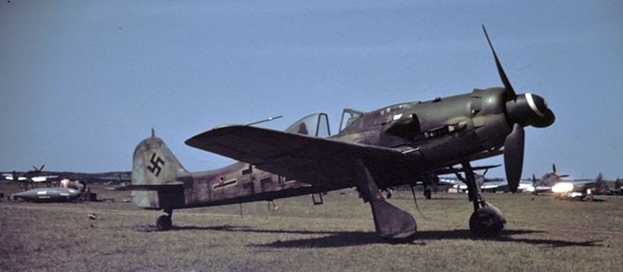 This captured Fw 190 D-9 appears to be a late production aircraft built by Fieseler at Kassel. It has a late style canopy; the horizontal black stripe with white outline shows that this was a II. Wikipedia.