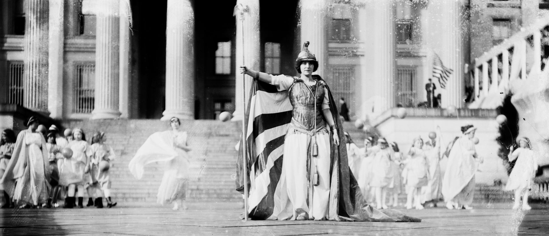 At the end of the procession, German actress Hedwig Reicher posed as Columbia on the steps of the Treasury Building. Library of Congress