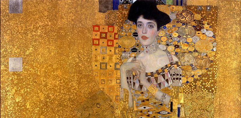 In Gustav Klimt's Portrait of Adele Bloch-Bauer, the wife of a a Jewish banker and sugar producer is rendered in stunning .