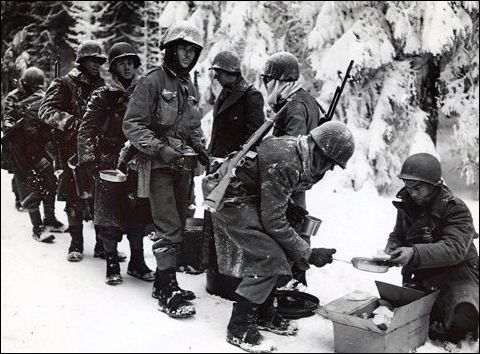 GIs line up for chow in the Hurtgen Forest in Germany, the longest single battle the U.S. Army has ever fought.