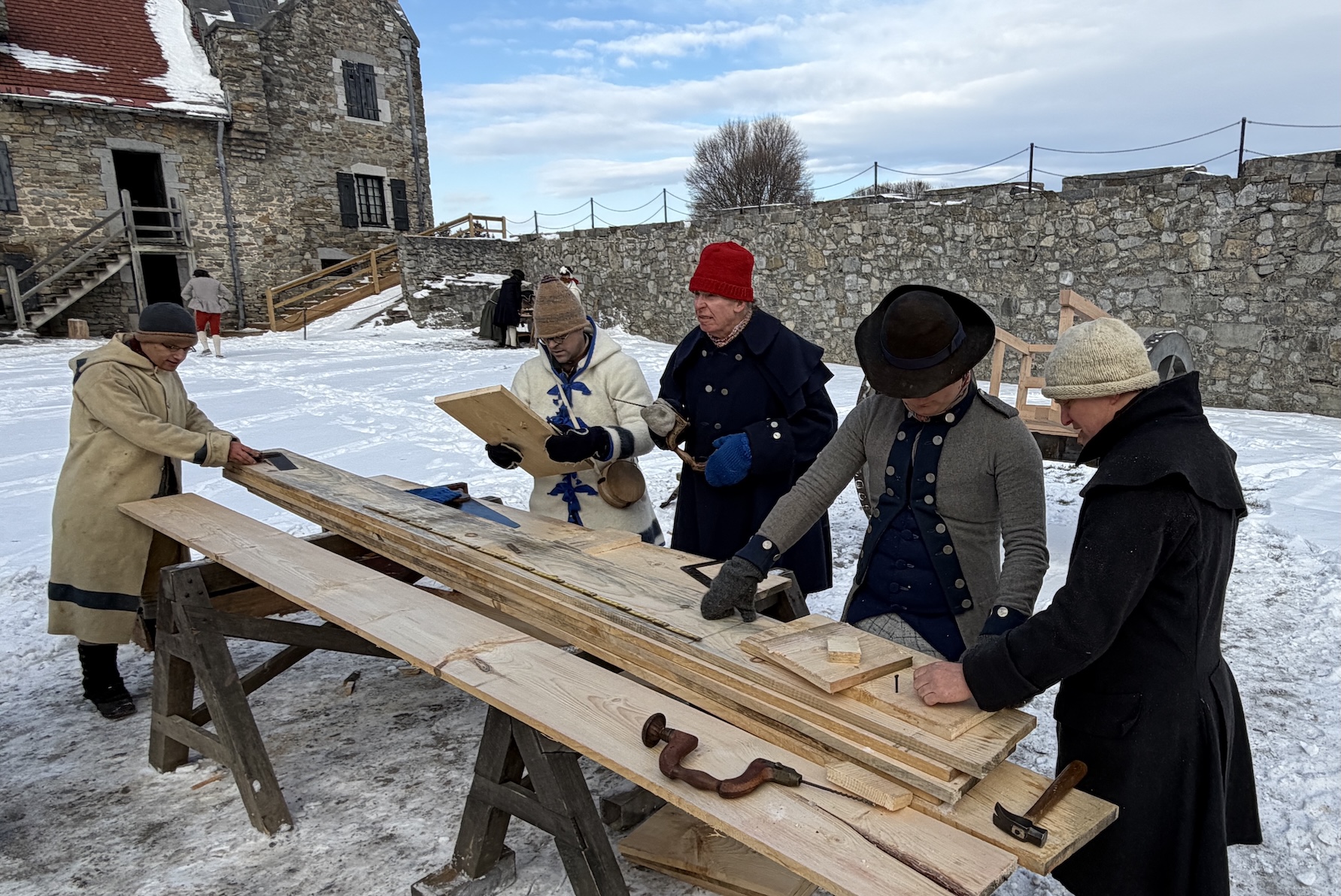Woodworkers preparing equipment for the cannon transport.
