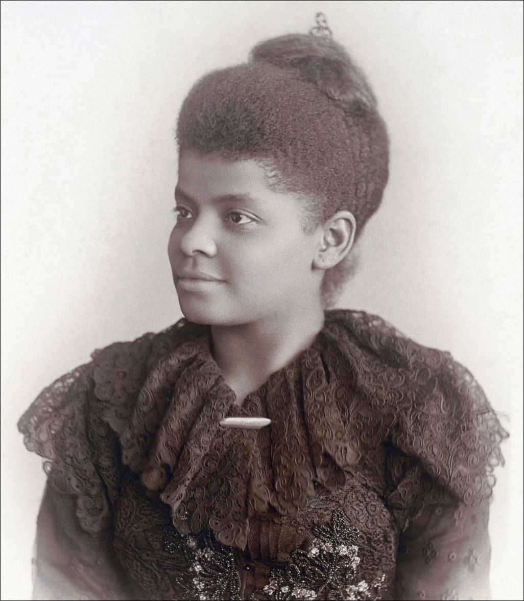 Not to be denied marching with the white Suffragettes, Ida Wells-Barnett hid in the crowd.