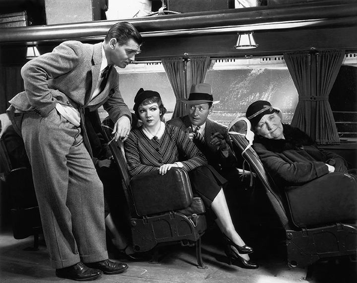 Clark Gable talks to Colette Colbert in It Happened One Night. Columbia Pictures