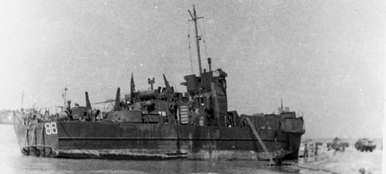 The LCIL was a marvel of design: its flat bottom and collapsible ramp permitted it to run right onto a beach. LCIL-88, which carried Liebling to Omaha Beach, had previously see rough service in North Africa where it was heavily damaged by German fire but later repaired.