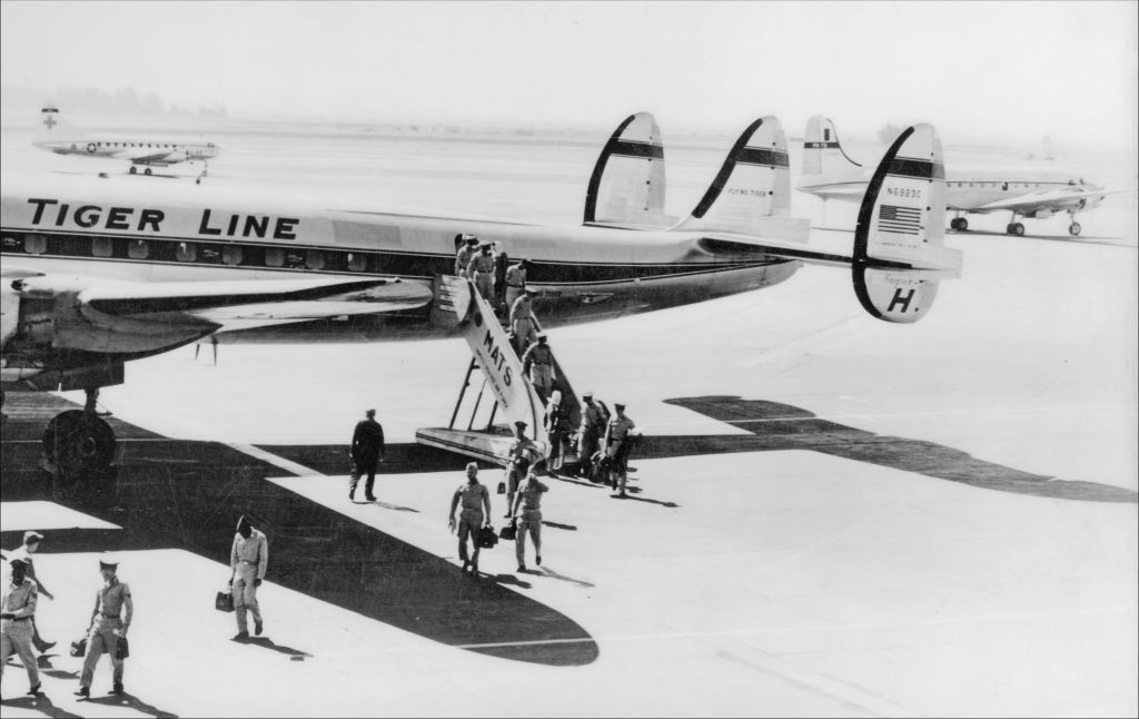 In the 1960s, the Flying Tiger line often flew passengers and cargo for the military in Constellations, a four-engine prop plane with distinctive triple tails.
