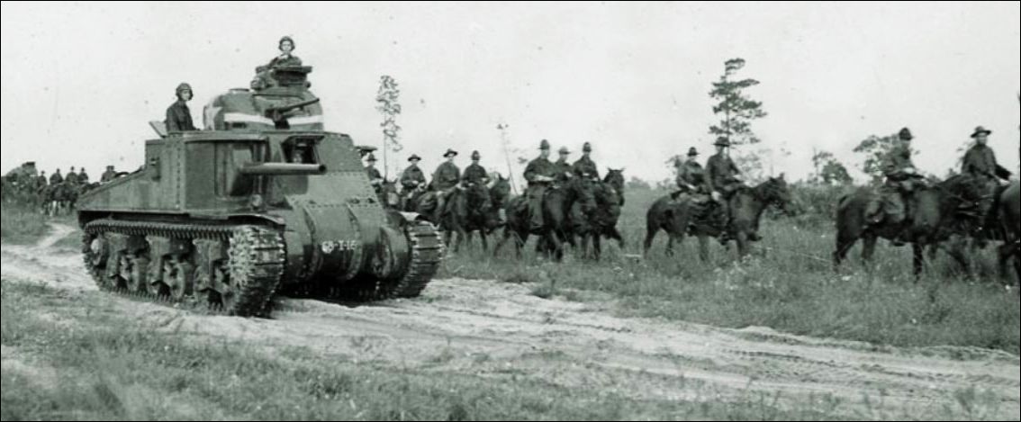 The cavalry rode alongside tanks during the Louisiana Maneuvers in 1941. National Archives.