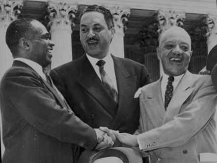 Thurgood Marshall (center) with George E.C. Hayes and James Nabri congratulate each other for winning an important case against segregation in 1954.