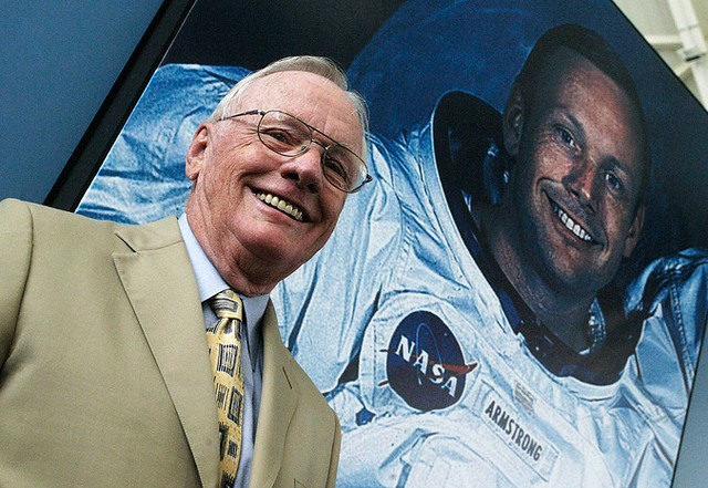 Legendary American astronaut Neil Armstrong poses on the background of his picture in 2005.&nbsp; Lyudmila Topchiy/NASA