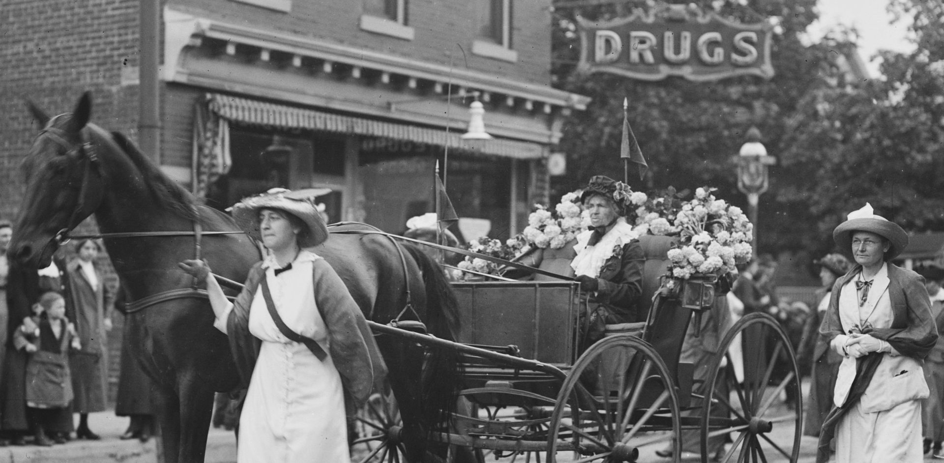 Born during the John Quincy Adams Administration, 86-year-old Mrs. Rhoda Glover  drove her own carriage in the parade and was called "the oldest Suffragette" in the event. Library of Congress