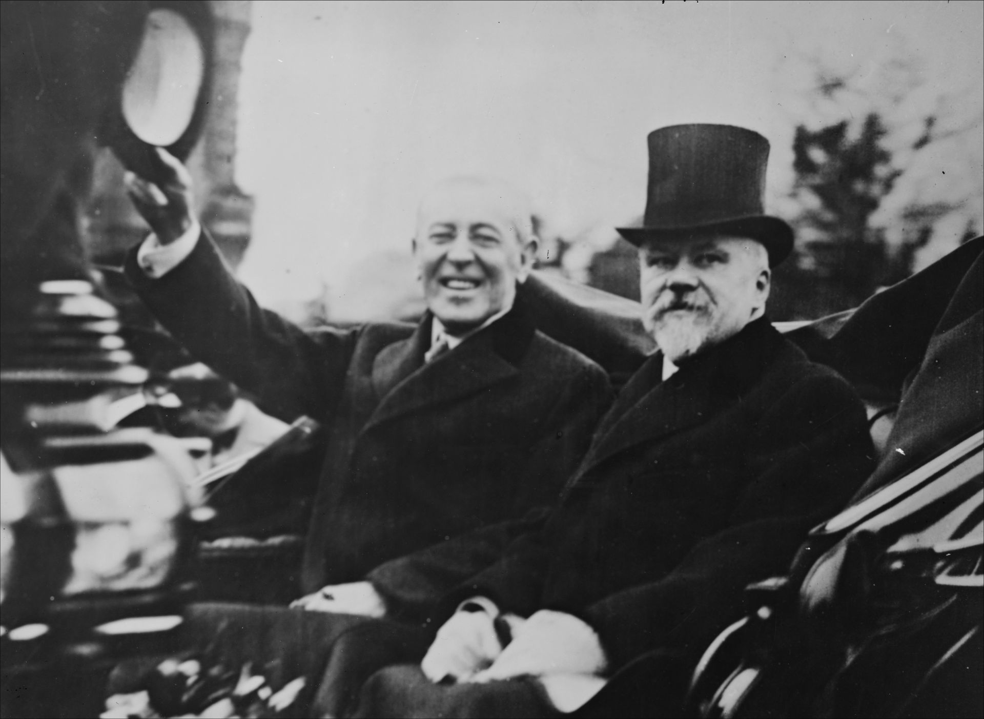With French President Raymond Poincar&eacute;, a buoyant Woodrow Wilson greeted crowds in Paris a month after the end of World War I.