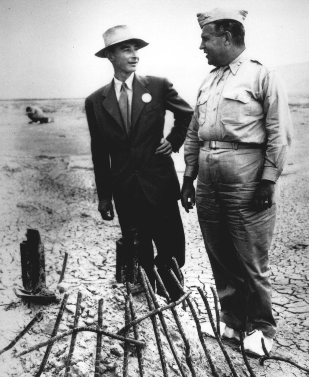 Physicist Robert Oppenheimer inspected damage from the blast at Ground Zero with Gen. Leslie Groves, military leader of the Manhattan Project.