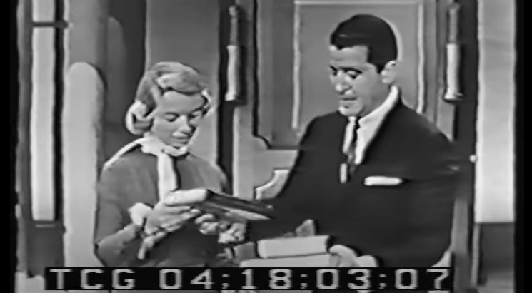 Dr. Joyce Brothers (left) with host of The $64,000 Question, Hal March, in 1955. (Screenshot: YouTube)