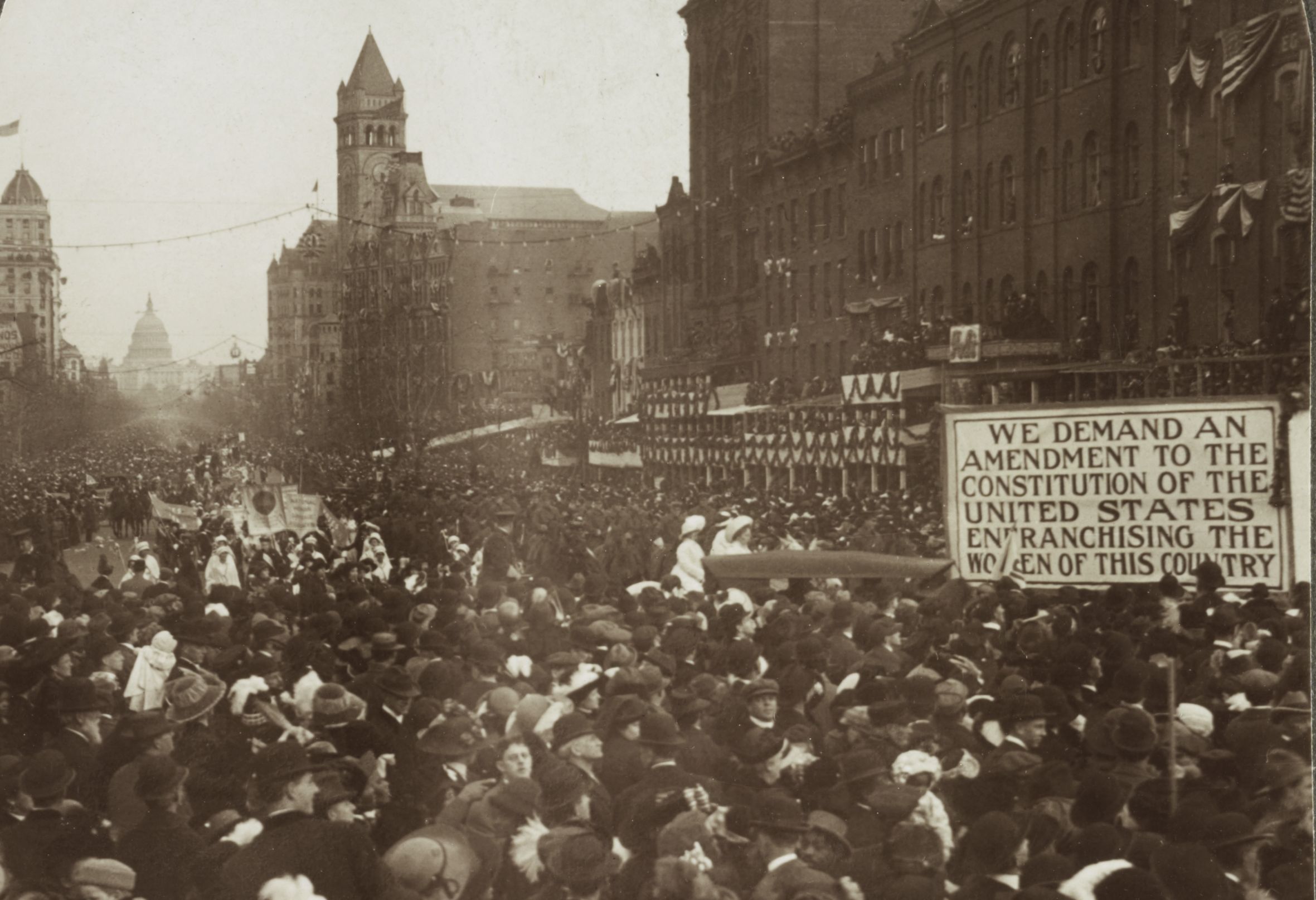 Male spectators crowded out the women marchers.