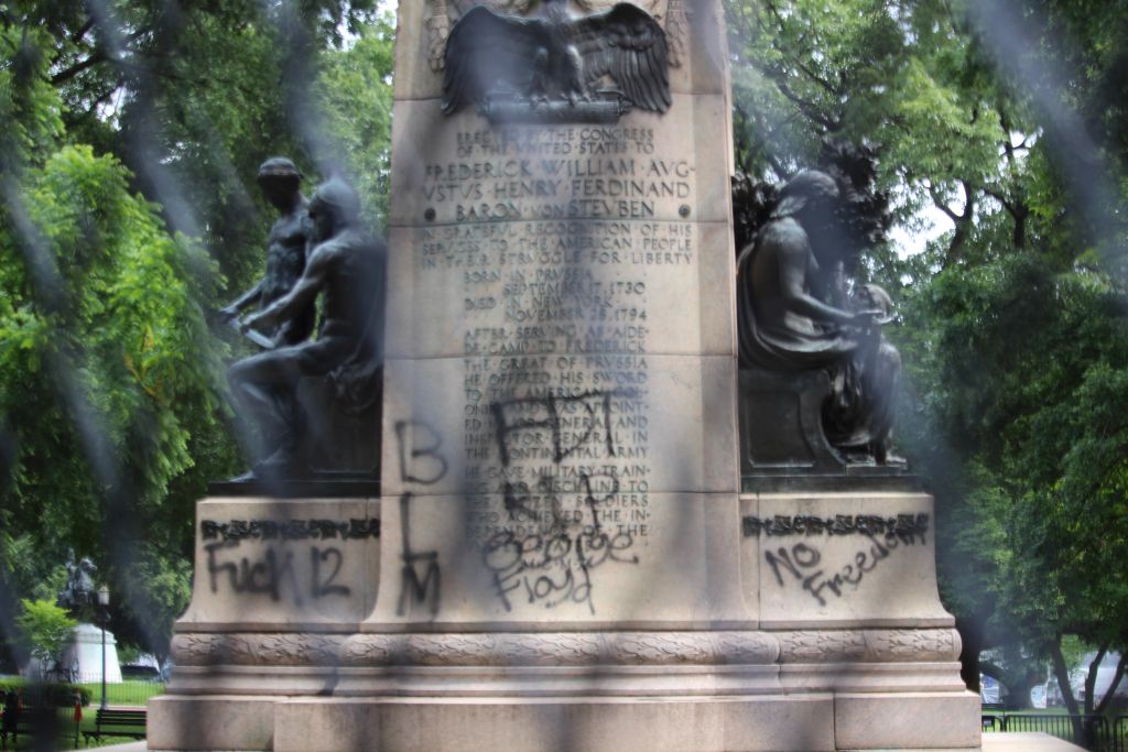 The statue of Baron von Steuben was also spray-painted by protesters. Edwin Grosvenor.