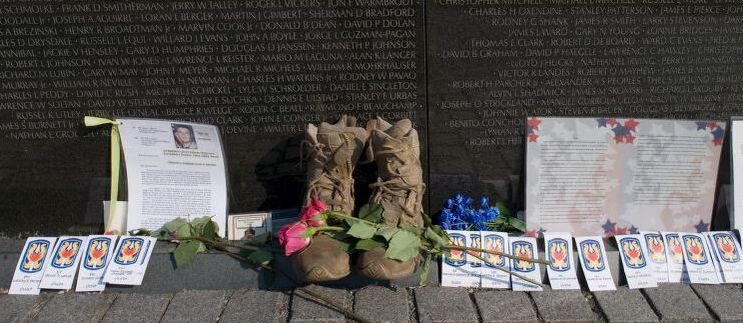 Today, family and former servicemen often leave mementoes by the names of the fallen. Library of Congress.