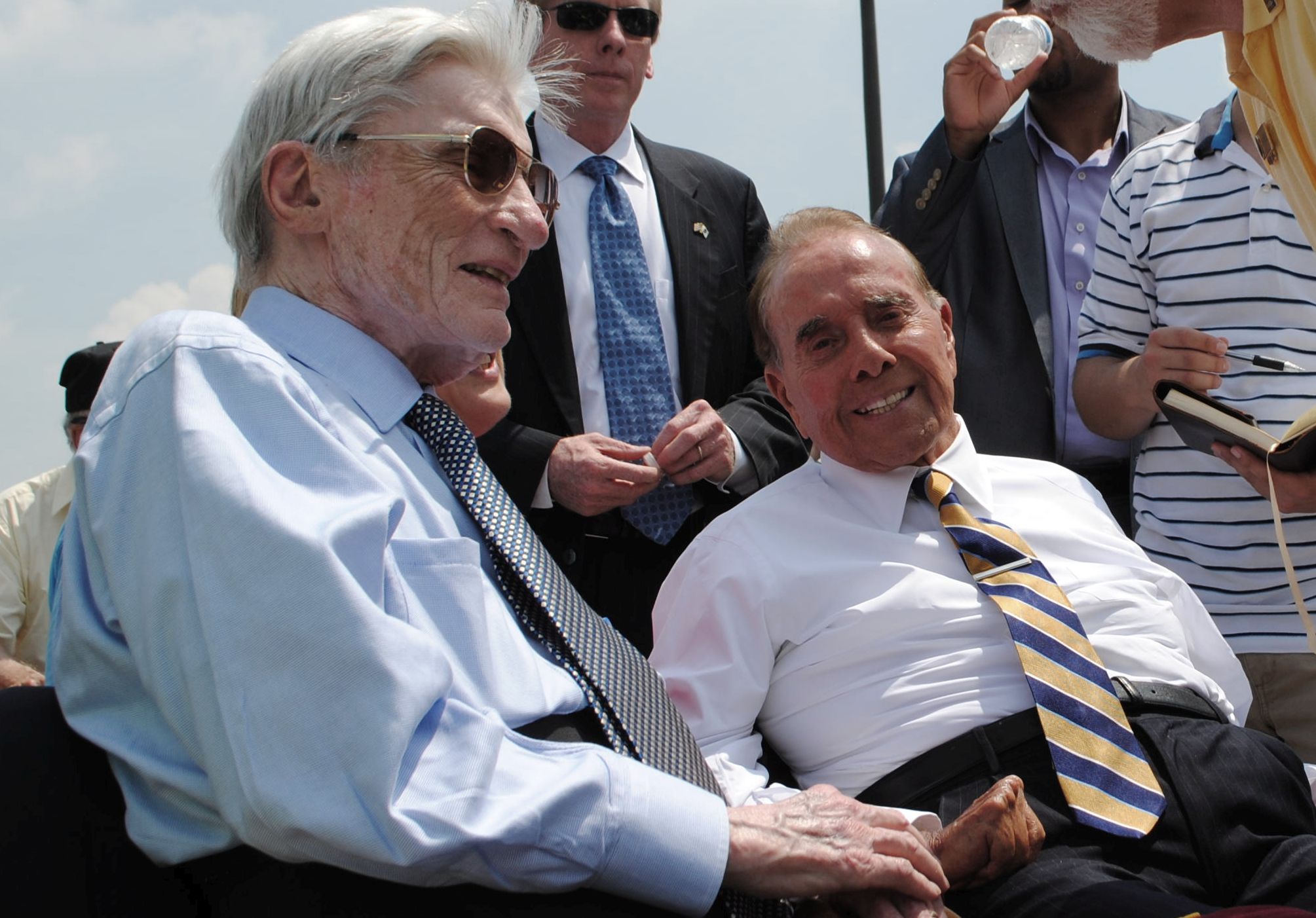 Former senators John Warner and Bob Dole enjoy the commemorations on V-E Day in 2015 at the World War II Memorial. Photo by Edwin Grosvenor.