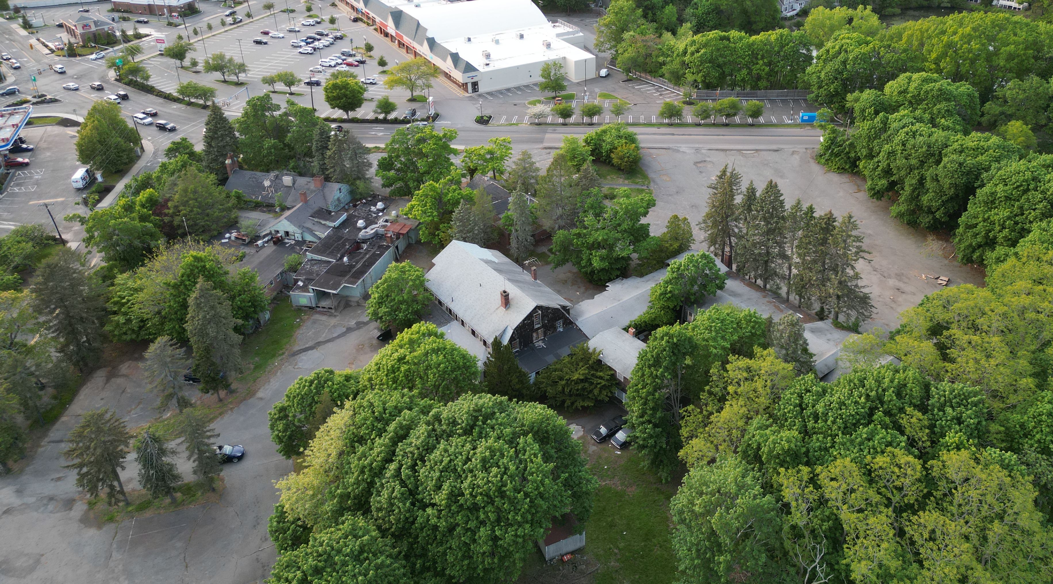 The original Glover farmhouse at left is now surrounded by trees. 