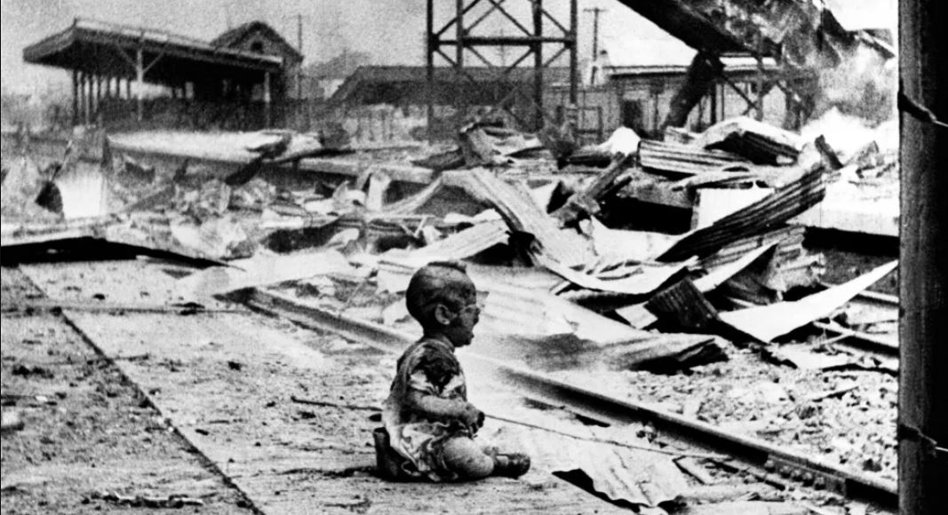 A lone child cries in the Shanghai railroad station after it was bombed by the Japanese in 1937.