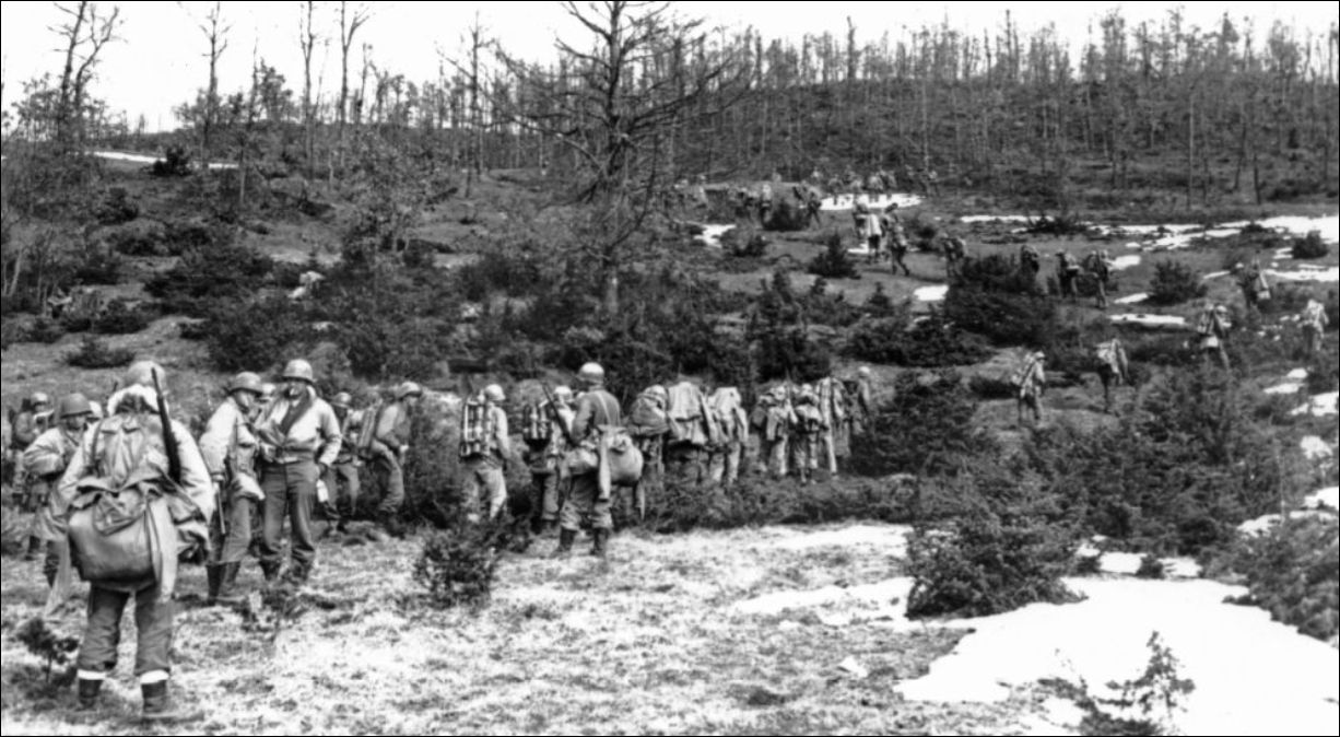 Soldiers of the 10th Mountain Division hike up Mt. Belvedere.