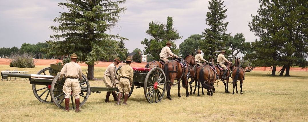 Soldiers at Fort Sill reenact a horse-drawn artillery unit from World War I.