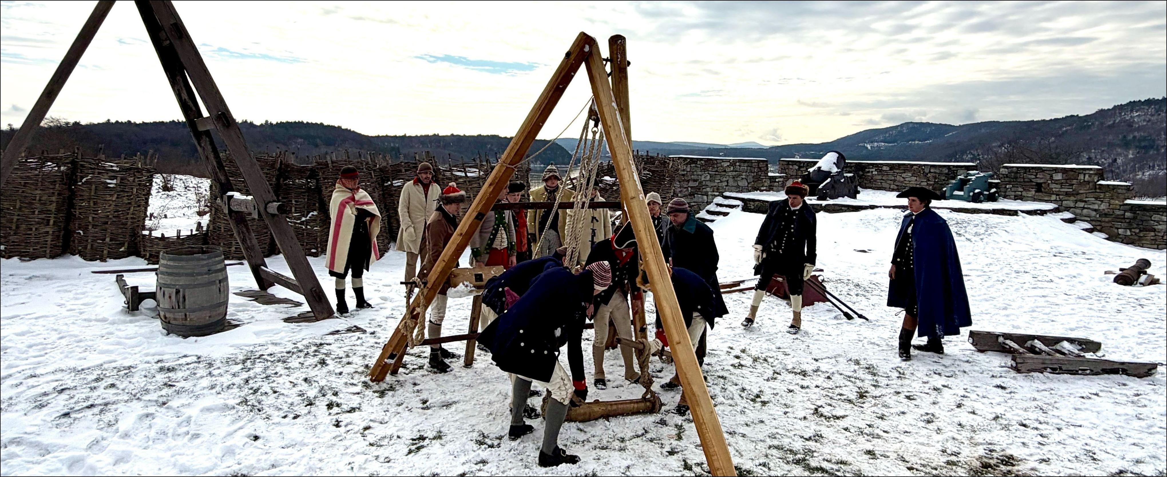 Reenacters at Ticonderoga built "gins", or large tripod devices, to lift cannon onto sleds and ox carts.
