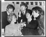 A testament to her rise, Dr. Joyce Brothers surrounded by the Beatles (l to r) John Lennon, Paul McCartney, Ringo Starr, and George Harrison in 1958. (Library of Congress)