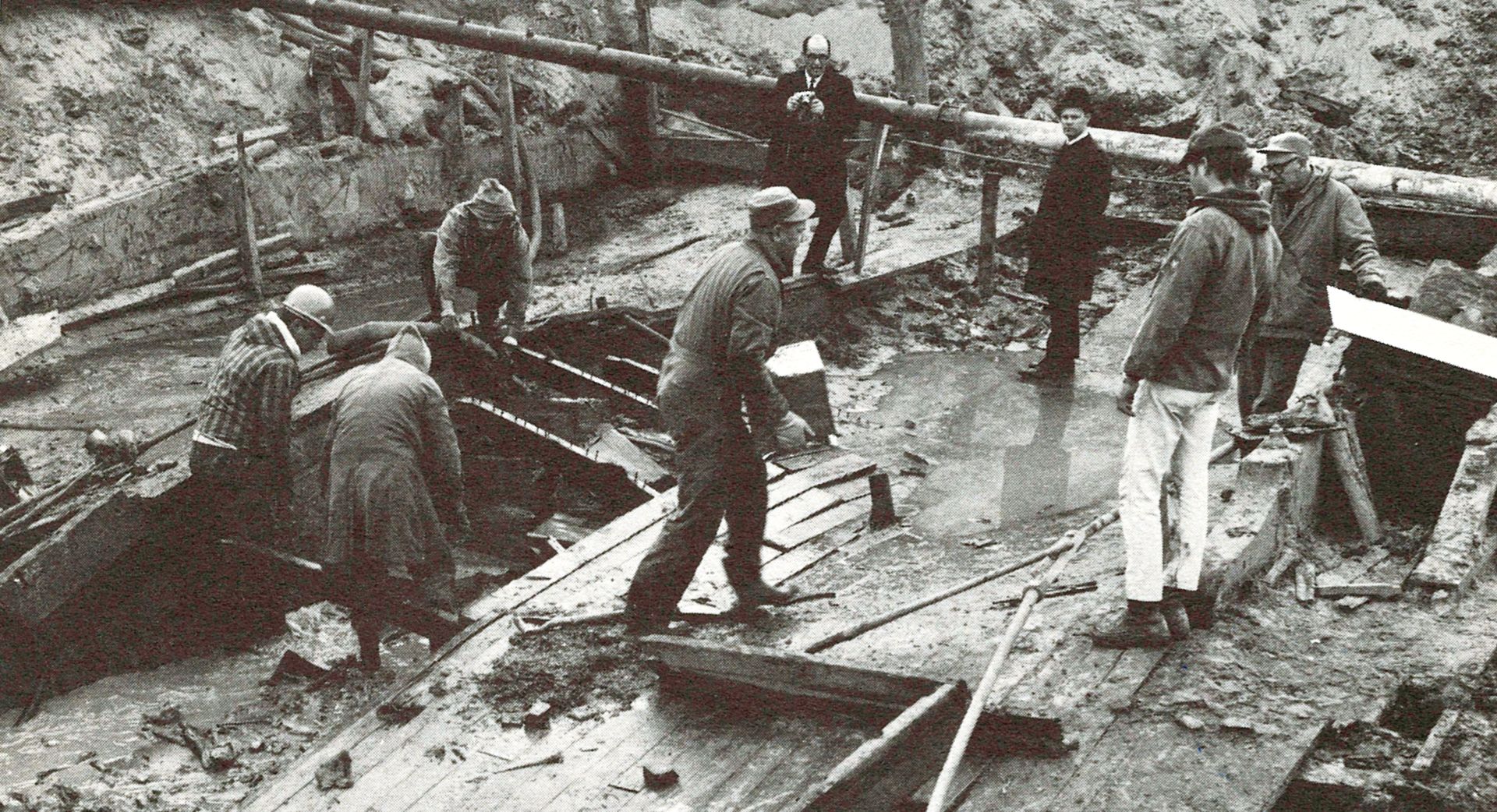 Workman remove cargo from the stern holds of the Bertrand.