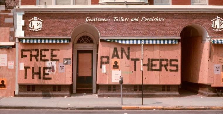 A Panther motto was painted incongruously on the storefront of J. Press in New Haven, purveyor of traditional collegiate clothing. Tom Strong.